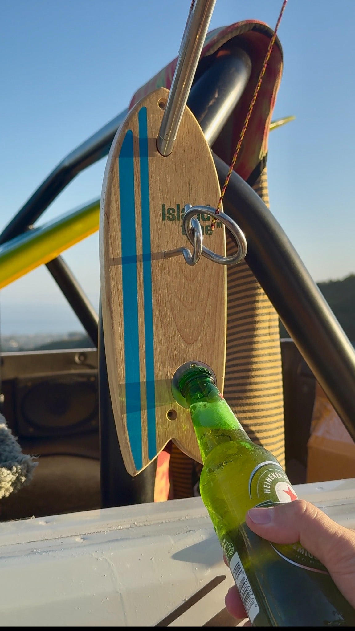 Using the built-in bottle opener on an Island Time Bottle Opener Pro hook and ring game